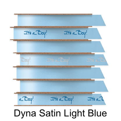 A stack of seven spools of shiny light blue satin ribbon with custom messages printed on them in different colors. 